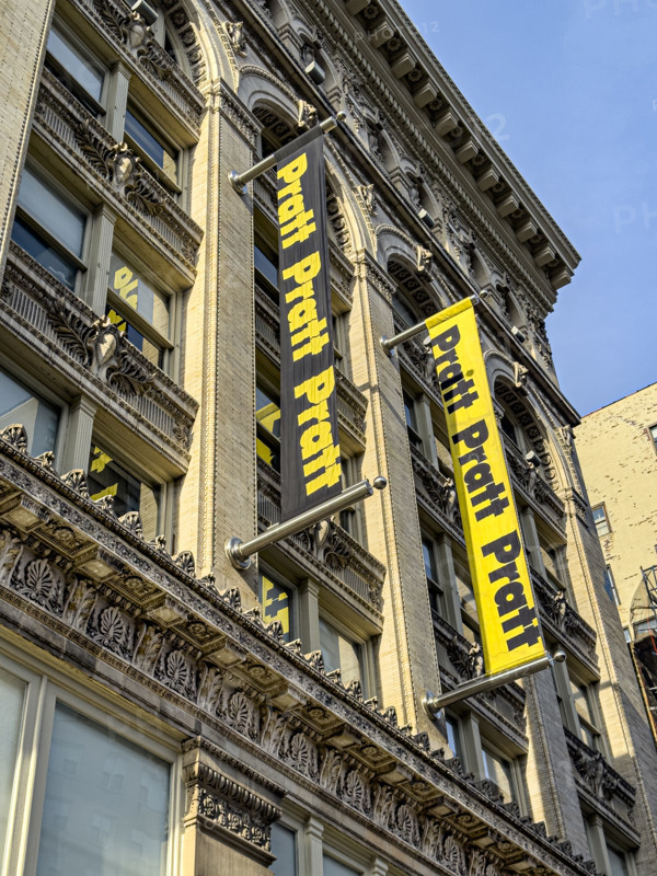 Pratt Institute, low angle view of building exterior and school banners, West 14th Street, New York City, New York, USA