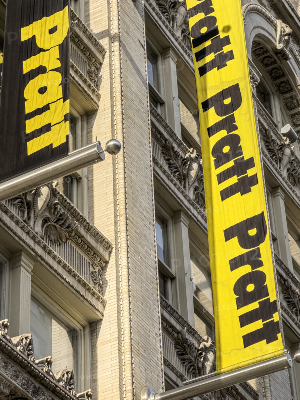 Pratt Institute, low angle view of building exterior and detail of school banners, West 14th Street, New York City, New York, USA