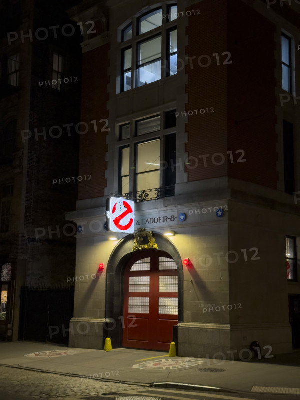 Beaux-Arts style firehouse from 1903 illuminated at night, made famous as the headquarters of the 1984 film,  "Ghostbusters", New York City, New York, USA