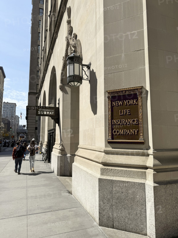 New York Life Insurance Company sign on New York Life building exterior and sidewalk scene, New York City, New York, USA