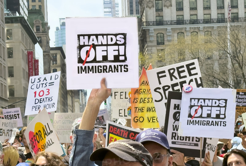 Demonstrators participating in "Our City, Our Fight: Protect Migrants, Protect the Planet" protest, New York City, New York, April 19, 2025