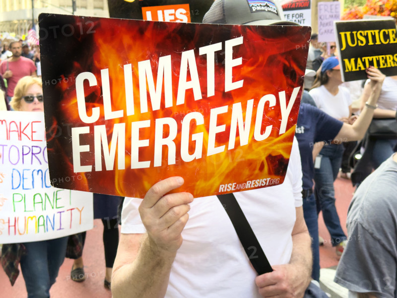 Demonstrators participating in "Our City, Our Fight: Protect Migrants, Protect the Planet" protest, New York City, New York, April 19, 2025