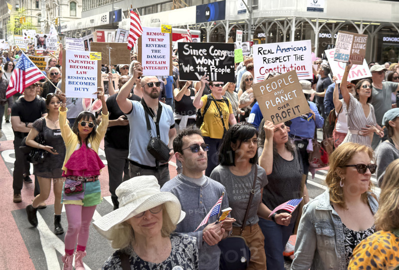 Demonstrators participating in "Our City, Our Fight: Protect Migrants, Protect the Planet" protest, New York City, New York, April 19, 2025
