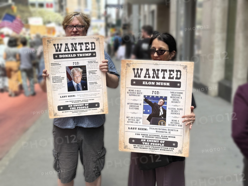 Demonstrators participating in "Our City, Our Fight: Protect Migrants, Protect the Planet" protest, New York City, New York, April 19, 2025
