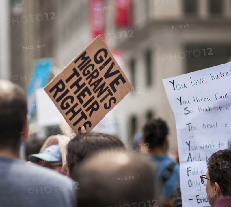 Demonstrators participating in "Our City, Our Fight: Protect Migrants, Protect the Planet" protest, New York City, New York, April 19, 2025