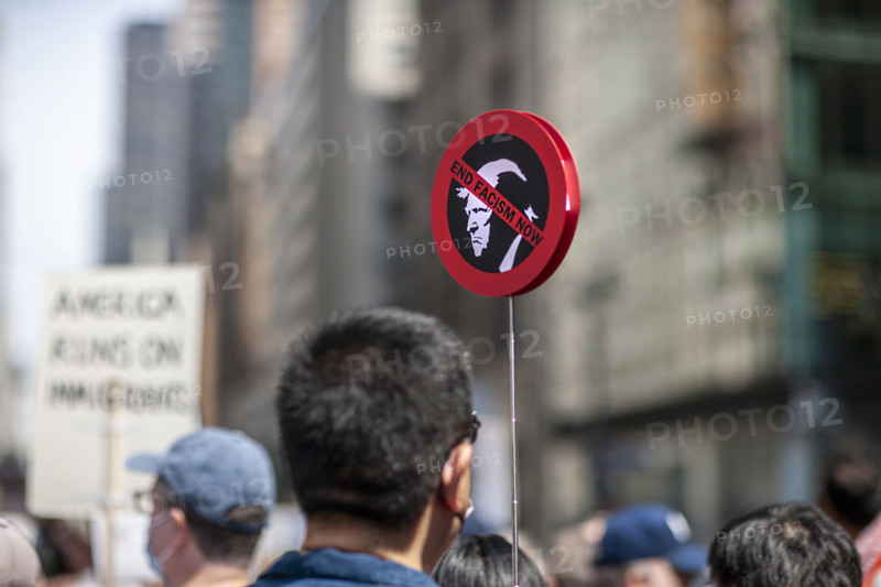 Demonstrators participating in "Our City, Our Fight: Protect Migrants, Protect the Planet" protest, New York City, New York, April 19, 2025