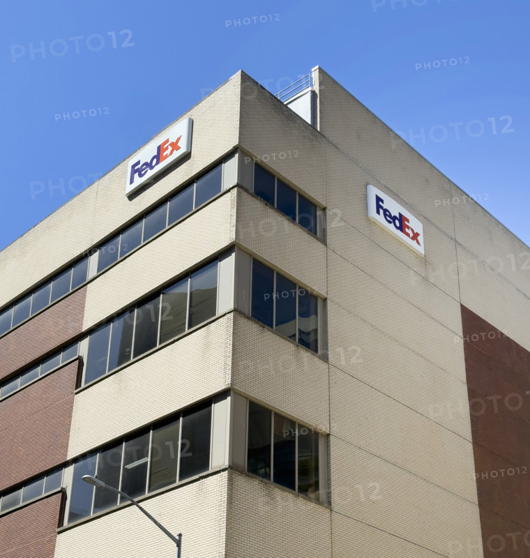 FedEx shipping center, building exterior with logo sign, New York City, New York, USA