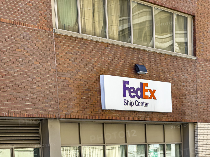 FedEx shipping center, building exterior with logo sign, New York City, New York, USA