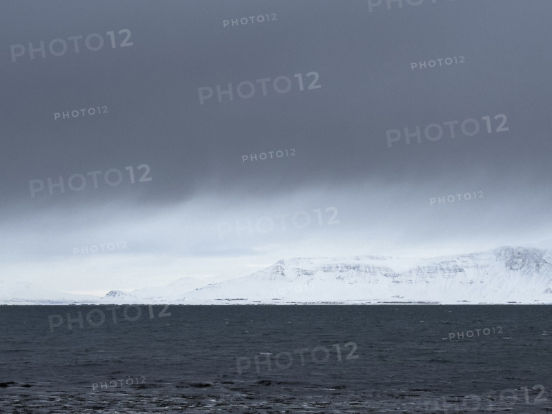 Mt. Esja viewed across inlet from Seltjarnarnes, Capital Region, Iceland on moody winter day