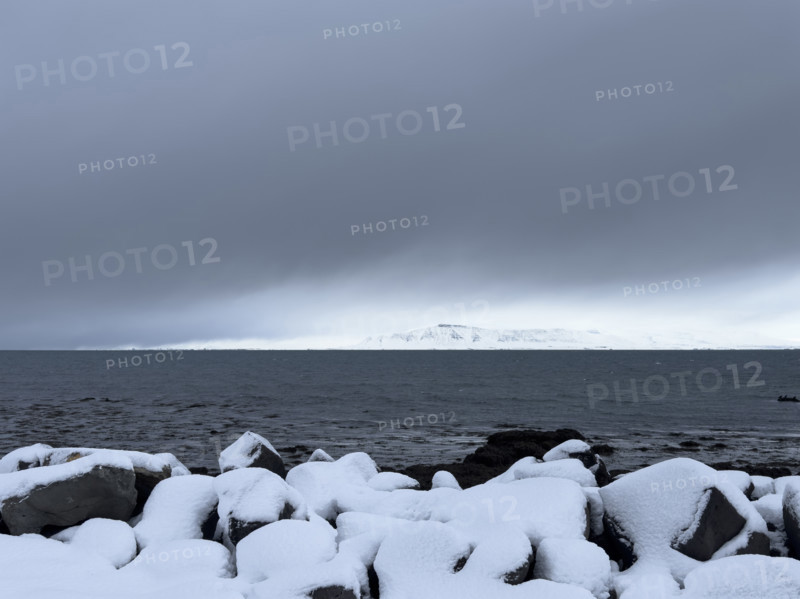 Mt. Esja viewed across inlet from Seltjarnarnes, Capital Region, Iceland on moody winter day