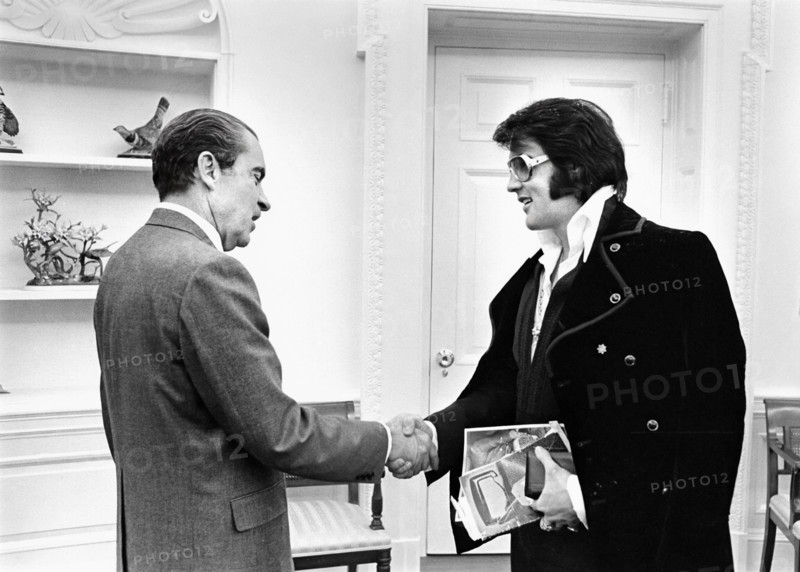 U.S. President Richard Nixon shaking hands with Elvis Presley during open hour in the Oval Office, White House, Washington, D.C., USA, White House Photo Office, December 21, 1970