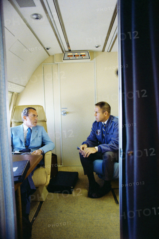 U.S. President Richard M. Nixon seated with White House Chief of Staff Harry Robbins "H.R." Haldeman on board Air Force One inside a private cabin enroute to China, White House Photo Office, February 20, 1972