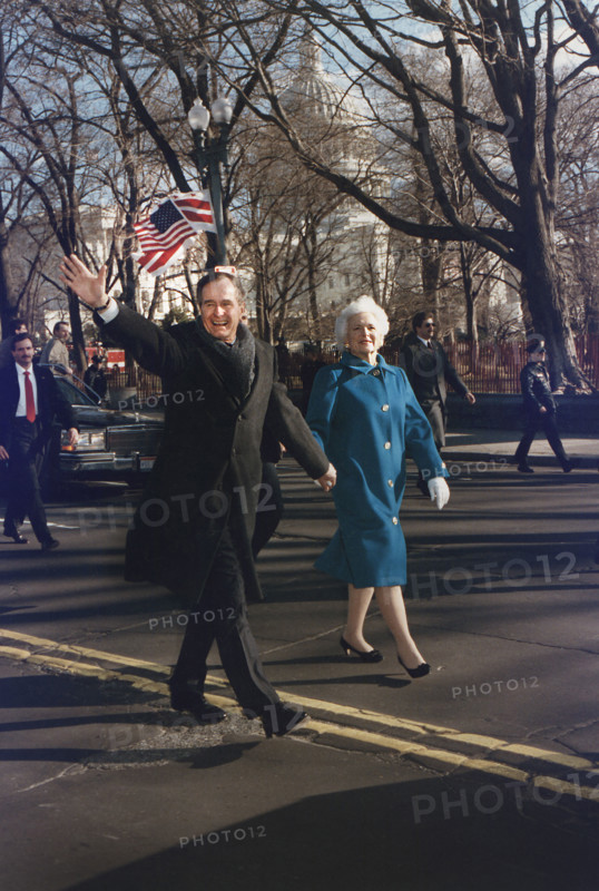 U.S. President George H.W. Bush and U.S. First Lady Barbara Bush walking along Pennsylvania Avenue after the President's Inauguration, Washington, D.C., USA, David Valdez, White House photographer, January 20, 1989