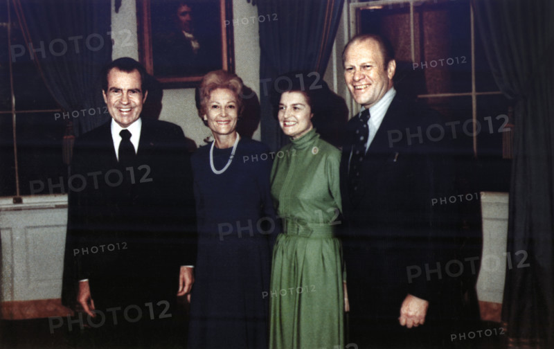 U.S. President Richard M. Nixon and U.S. First Lady Pat Nixon with Representative Gerald R. Ford and Betty Ford in the Blue Room of the White House, Following the Nomination of Gerald Ford as Vice President, Washington, D.C., USA, White House Photo Office, October 12, 1973