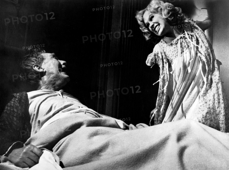 Burgess Meredith, Karen Black, on-set of the film, "The Day Of The Locust", Paramount Pictures, 1975