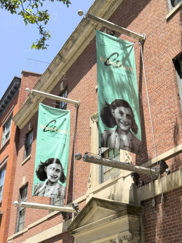 Banners promoting Anne Frank exhibit hanging from exterior of Center for Jewish History building, New York City