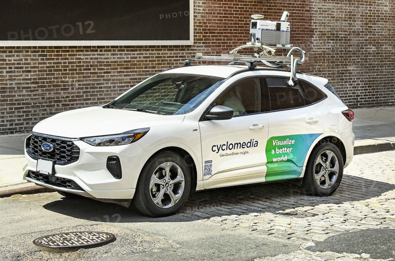 Cyclomedia car with camera equipment on roof used for capturing visual data from public spaces, New York City