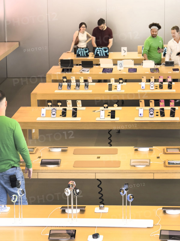 Customers shopping in Apple Store, West 14th Street, New York City