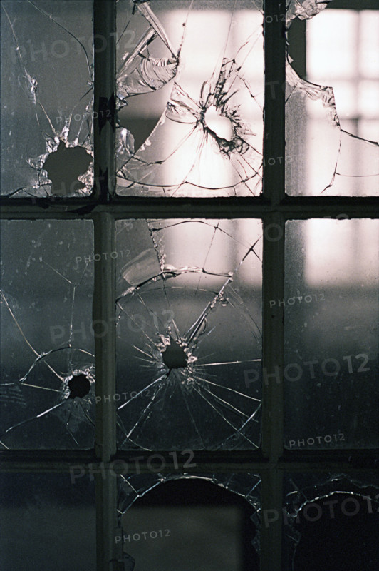 Broken window panes in abandoned building