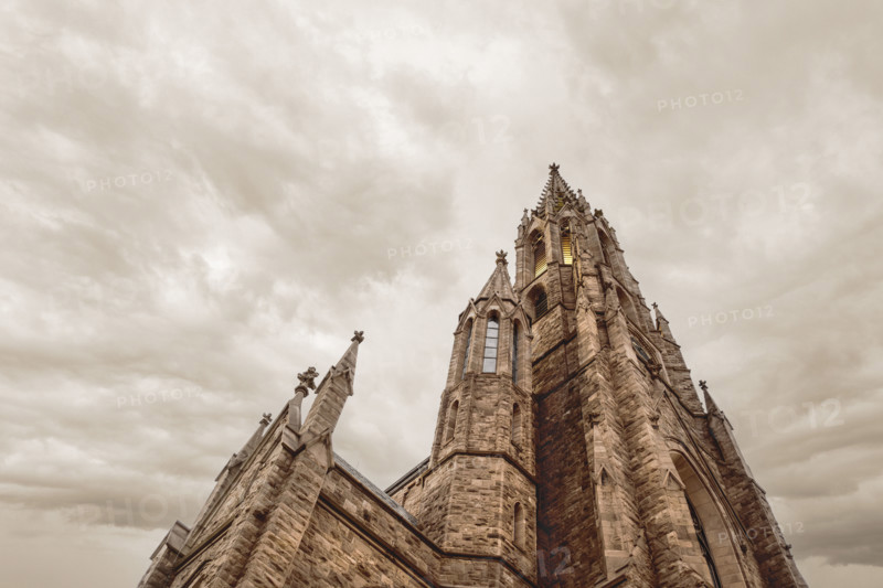 Low angle view of St. Louis Roman Catholic Church, low angle view against dramatic cloudy sky, Buffalo, New York, USA