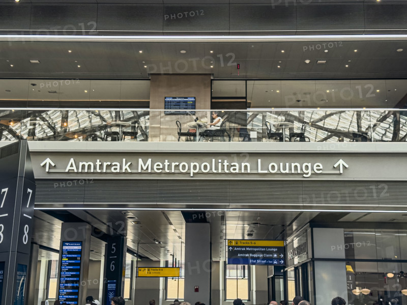 Direction sign for Amtrak Metropolitan Lounge, Moynihan Train Hall, Pennsylvania Station, Manhattan, New York City, New York, USA