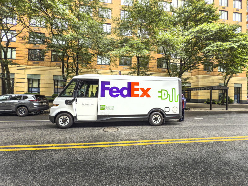 Federal Express electric delivery truck and street scene, Manhattan, New York City, New York, USA