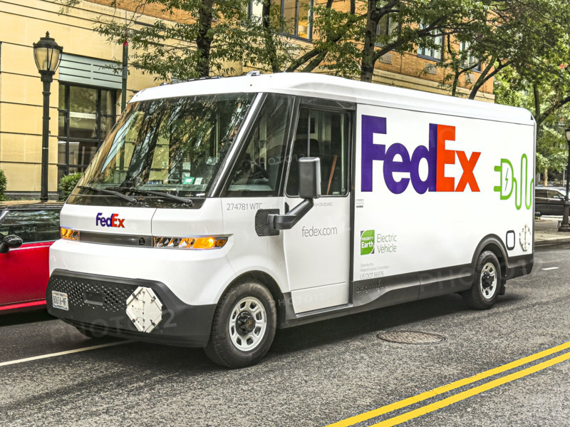 Federal Express electric delivery truck and street scene, Manhattan, New York City, New York, USA
