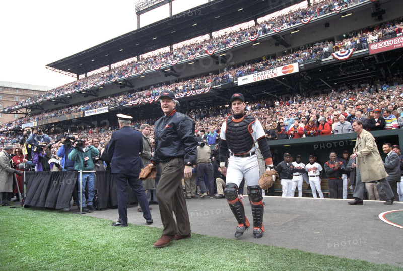 U.S. President Bill Clinton attending opening day baseball game between the Baltimore Orioles and Texas Rangers, Camden Yards Ballpark, Baltimore, Maryland, USA, Bob McNeely, White House Photographer, April 5, 1993