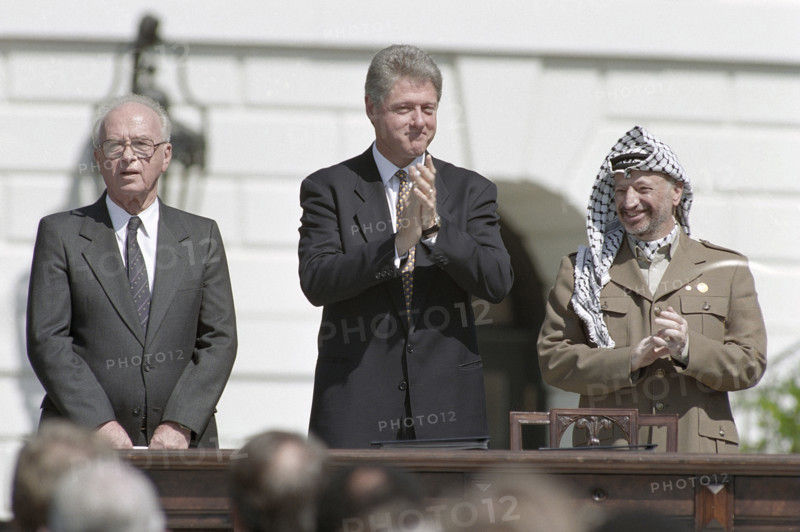 Israeli Prime Minister Yitzhak Rabin, U.S. President Bill Clinton and Palestine Liberation Organization Chairman Yasser Arafat during ceremony for Middle East Peace agreement signing, South Lawn of White House, Washington, D.C., USA, Vince Musi, White House Photographer, September 13, 1993