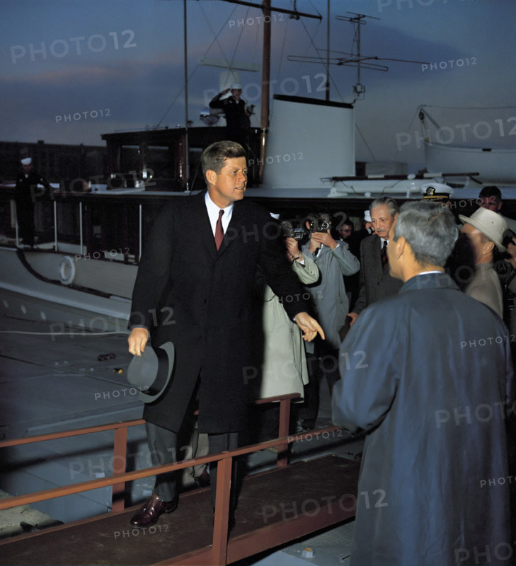 U.S. President John F. Kennedy walking away from Presidential yacht "Honey Fitz" following afternoon meetings with British Prime Minister Harold MacMillan on the Potomac River, Washington, D.C., USA, Robert Knudsen, White House Photographs, April 6, 1961