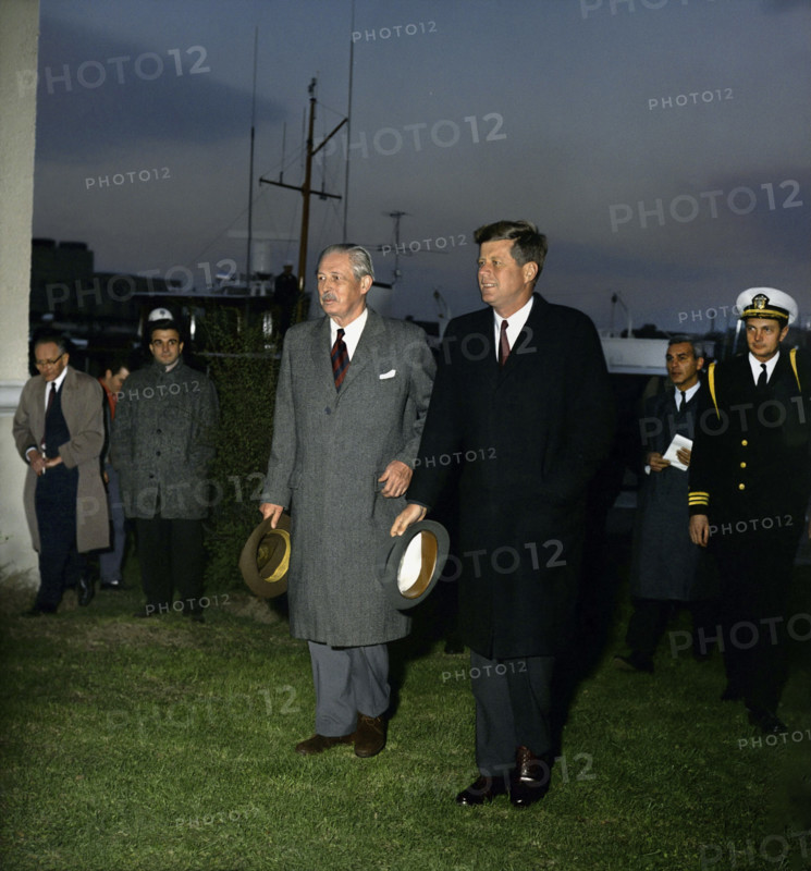 U.S. President John F. Kennedy with British Prime Minister Harold MacMillan walking away from Presidential yacht "Honey Fitz" following afternoon meetings on the Potomac River, Washington, D.C., USA, Robert Knudsen, White House Photographs, April 6, 1961