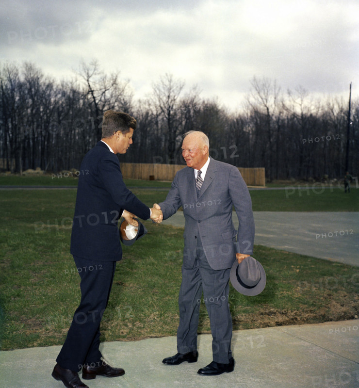 U.S. President John F. Kennedy shaking hands with former U.S. President Dwight D. Eisenhower, Camp David, Frederick County Maryland, USA, Robert Knudsen, White House Photographs, April 22, 1961