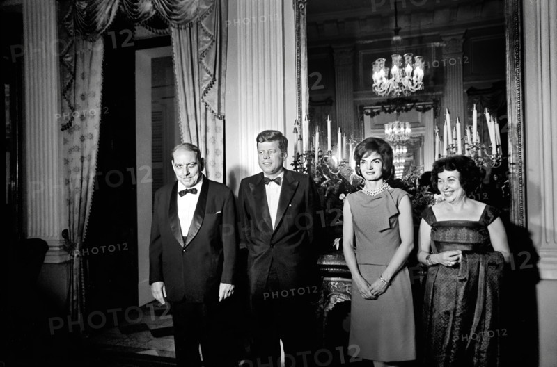 U.S. President John F. Kennedy and U.S. First Lady Jacqueline Kennedy attending dinner hosted by Governor of Puerto Rico Luis Muñoz Marín (far left) and  First Lady of Puerto Rico Inés Mendoza (far right) at the Governor’s mansion, San Juan, Puerto Rico, Cecil Stoughton, White House Photographs, December 15, 1961