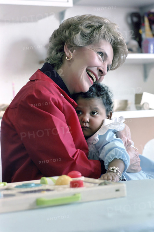 US. First Lady Nancy Reagan holding child while visiting Columbia Presbyterian Medical Center, Manhattan, New York City, New York, USA, President Ronald Reagan White House Photographic Office, October 27, 1982