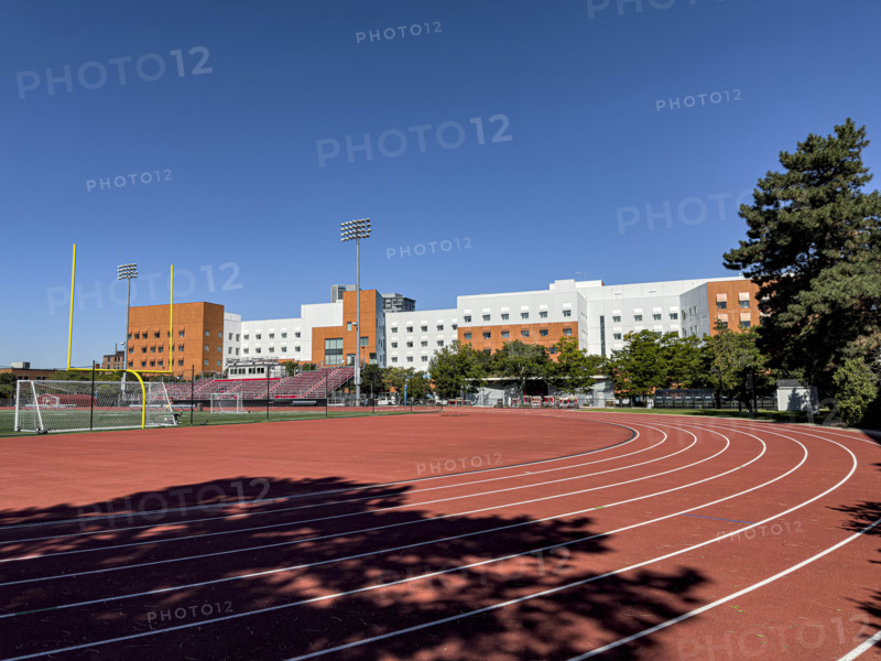 Running track and athletics field with New Vassar undergraduate dormitory in background, Massachusetts Institute of Technology, 189 Vassar Street, Cambridge, Massachusetts, USA
