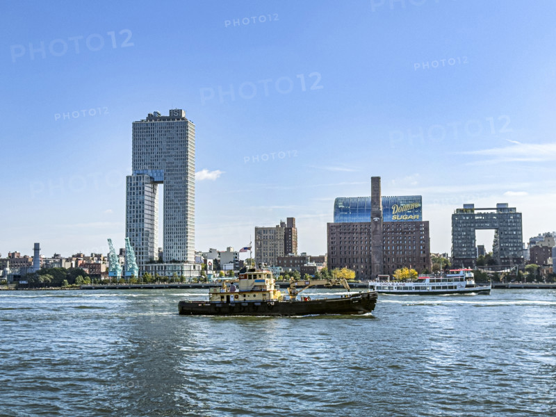 Circle Line ferry and tugboat in East River against Williamsburg cityscape, Brooklyn, New York City, New York, USA