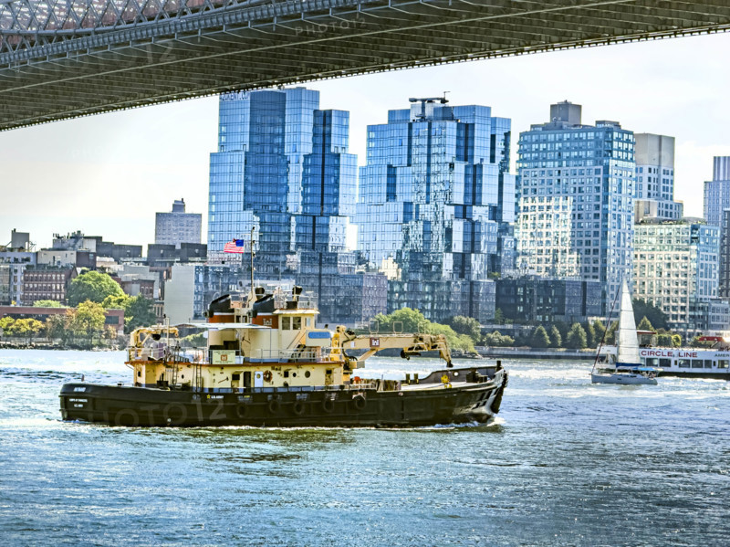Tugboat in East River with Williamsburg cityscape in background, Brooklyn, New York City, New York, USA