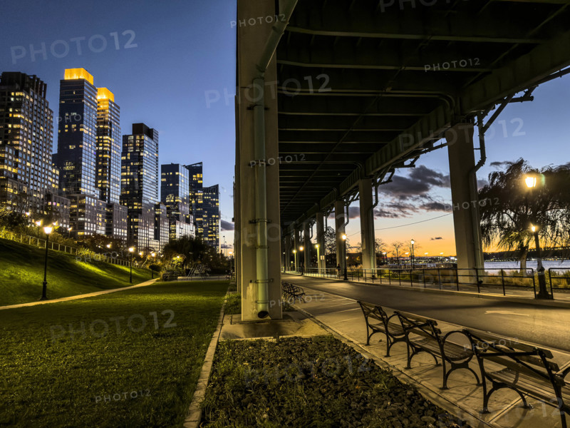 Pedestrian and bicycle paths underneath West Side Highway at night, Riverside Park South, Upper West Side, Manhattan, New York City, New York, USA