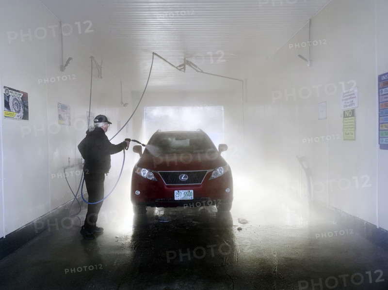 Man washing car at self-service car wash