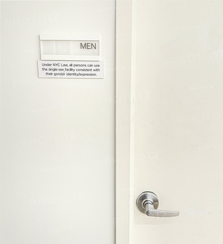 Sign for public bathroom allowing all persons the right to use single-sex facility consistent with their gender identity/expression, New York City, New York, USA