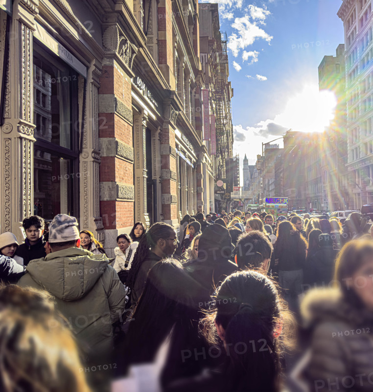 Crowded sidewalk scene on sunny day, Broadway, Soho, Manhattan, New York City, New York, USA,