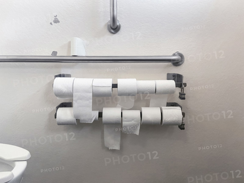 Selection of toilet paper rolls in public bathroom