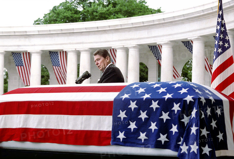 U.S. President Ronald Reagan speaking at podium during Memorial Day ceremony honoring the Vietnam unknown soldier, Arlington National Cemetery, Arlington, Virginia, USA, President Ronald Reagan White House Photographic Office, May 28, 1984