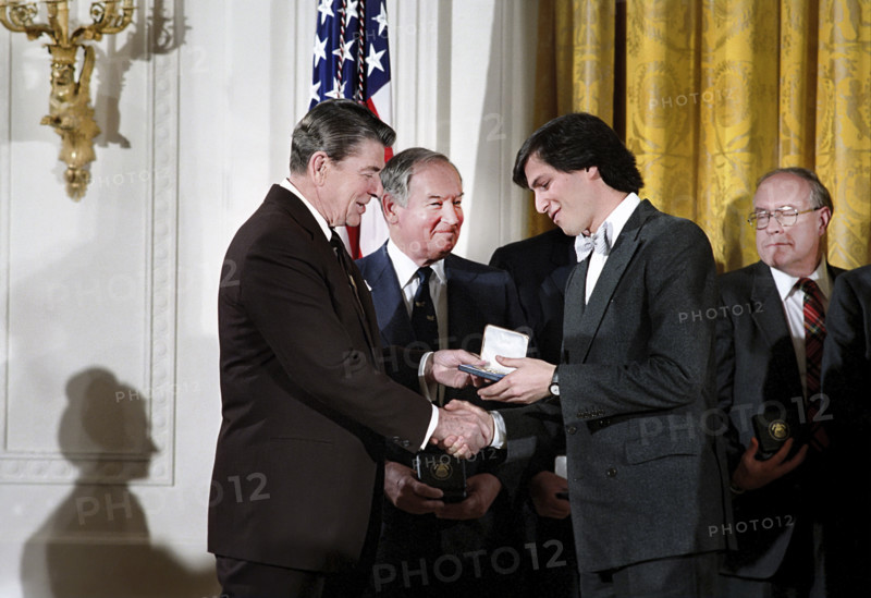 U.S. President Ronald Reagan during a ceremony to present the 1985 National Technology Awards to Steven Jobs in the East Room of the White House, Washington, D.C., USA, February 19, 1985
