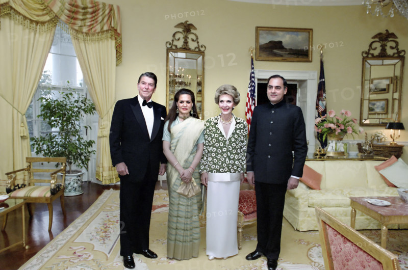U.S. President Ronald Reagan and U.S. First Lady Nancy Reagan Indian Prime Minister Rajiv Gandhi and his wife Sonia Gandhi in The Yellow Oval Room during a state dinner, Washington, D.C., USA, President Ronald Reagan White House Photographic Office, June 12, 1985