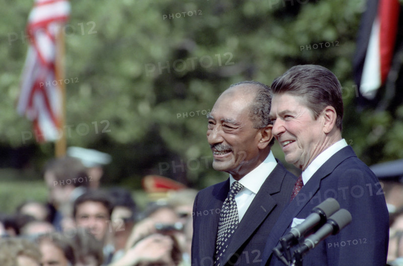 U.S. President Ronald Reagan and Egyptian President Anwar El Sadat on the White House south lawn at the arrival ceremony in honor of Sadat's state visit, Washington, D.C., USA, President Ronald Reagan White House Photographic Office, August 5, 1981
