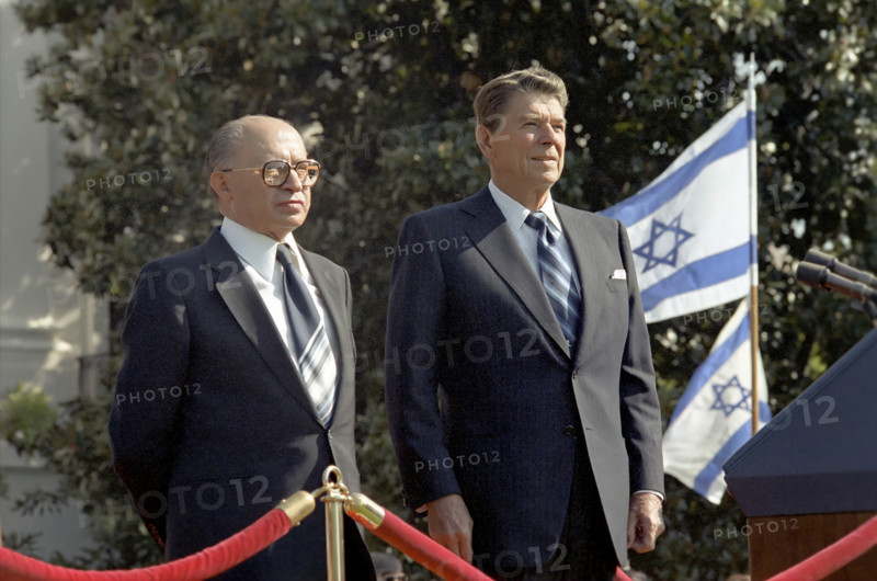 U.S. President Ronald Reagan and Prime Minister Menachem Begin of Israel  during Begin's arrival ceremony for State Visit on South Lawn of White House, Washington, D.C., USA, President Ronald Reagan White House Photographic Office, September 9, 1981