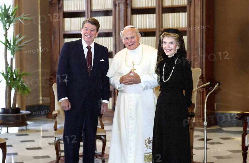U.S. President Ronald Reagan and U.S. First Lady Nancy Reagan visiting with Pope John Paul II in library of The Vatican Pontifical Palace during visit to Italy, President Ronald Reagan White House Photographic Office, June 6, 1987