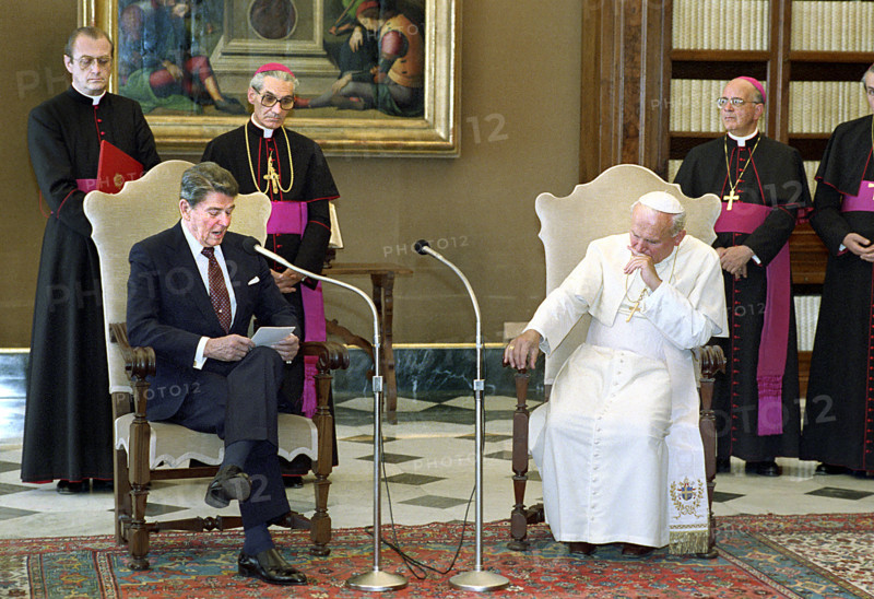 U.S. President Ronald Reagan visiting with Pope John Paul II in library of The Vatican Pontifical Palace during visit to Italy, President Ronald Reagan White House Photographic Office, June 6, 1987