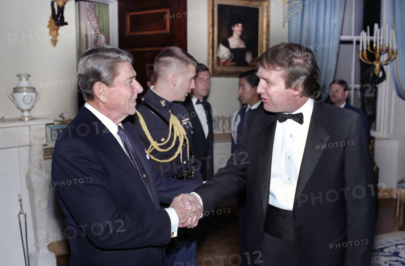 U.S. President Ronald Reagan shaking hands with Donald Trump at reception for members of the "Friends of Art and Preservation in Embassies" foundation, White House Blue Room, Washington, D.C., USA, President Ronald Reagan White House Photographic Office, November 3, 1987